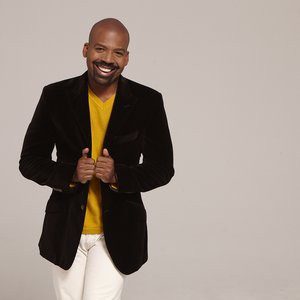 Who says you can't wear white pants year 'round? Lloyd says as long as the fabric is season appropriate, you're good to go. Here we see how a vibrant V-neck sweater can add the perfect pop of color to a textured chocolate jacket.